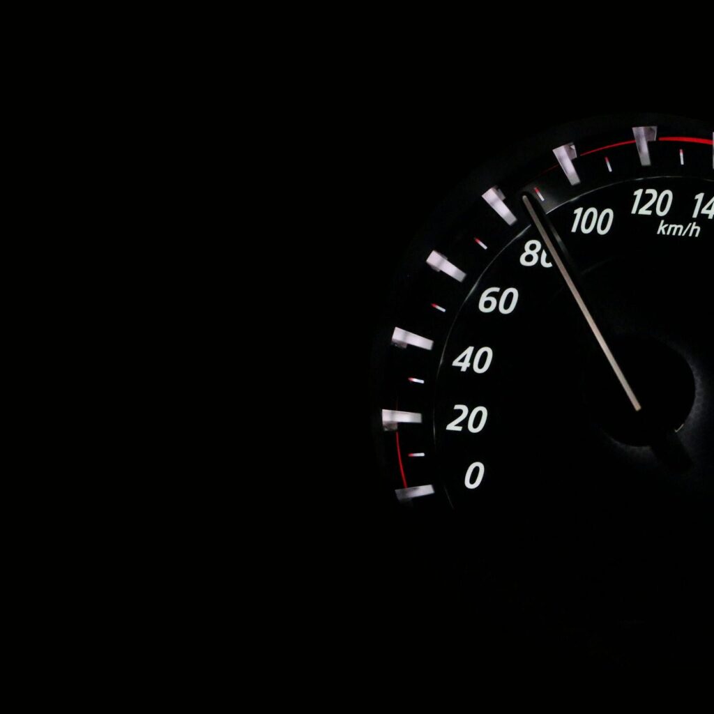 Speedometer reading showing speed in km/h on a dark background.